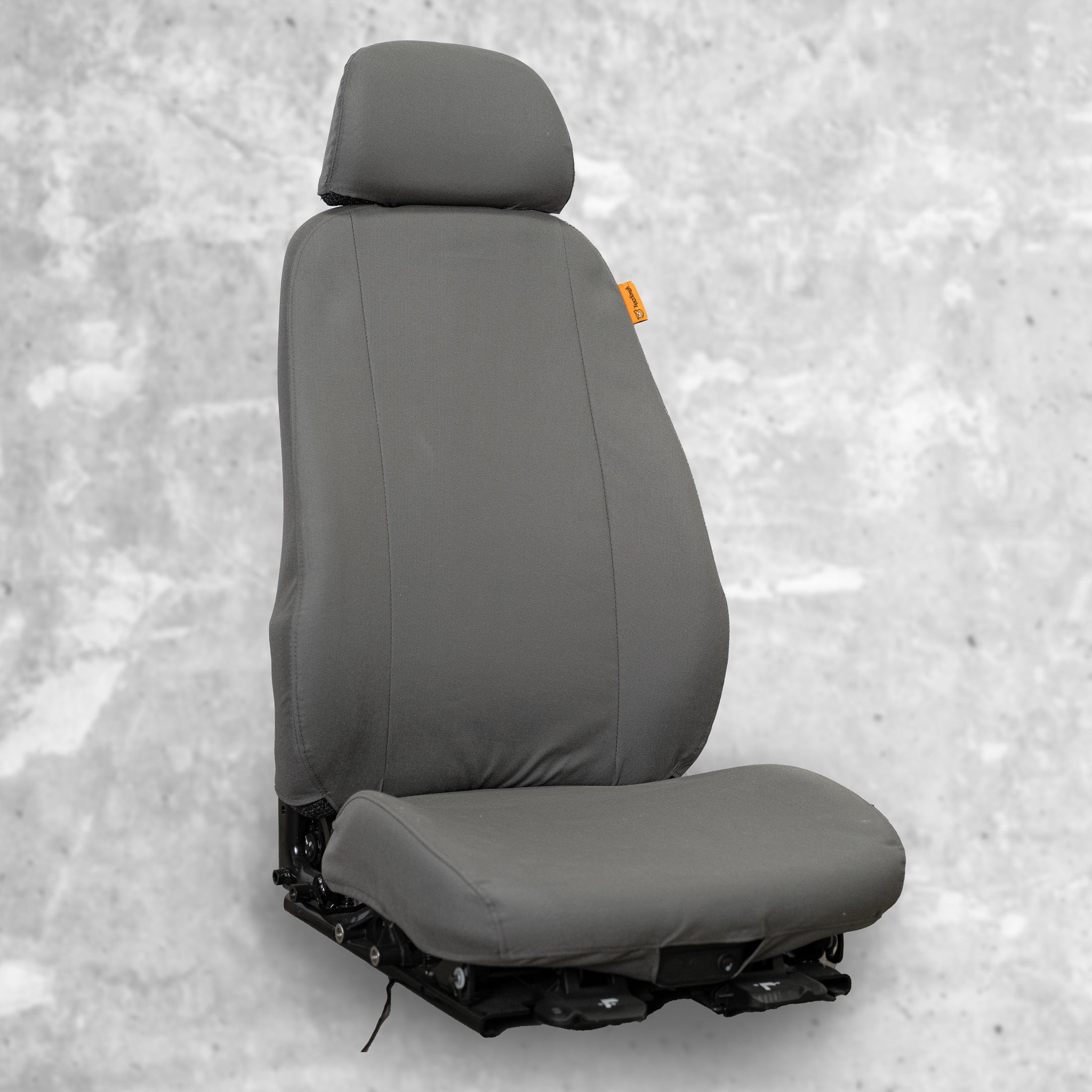 TigerTough Seat Cover for a heavy equipment seat. This picture shows the great fit and the separate back, bottom, and headrest pieces