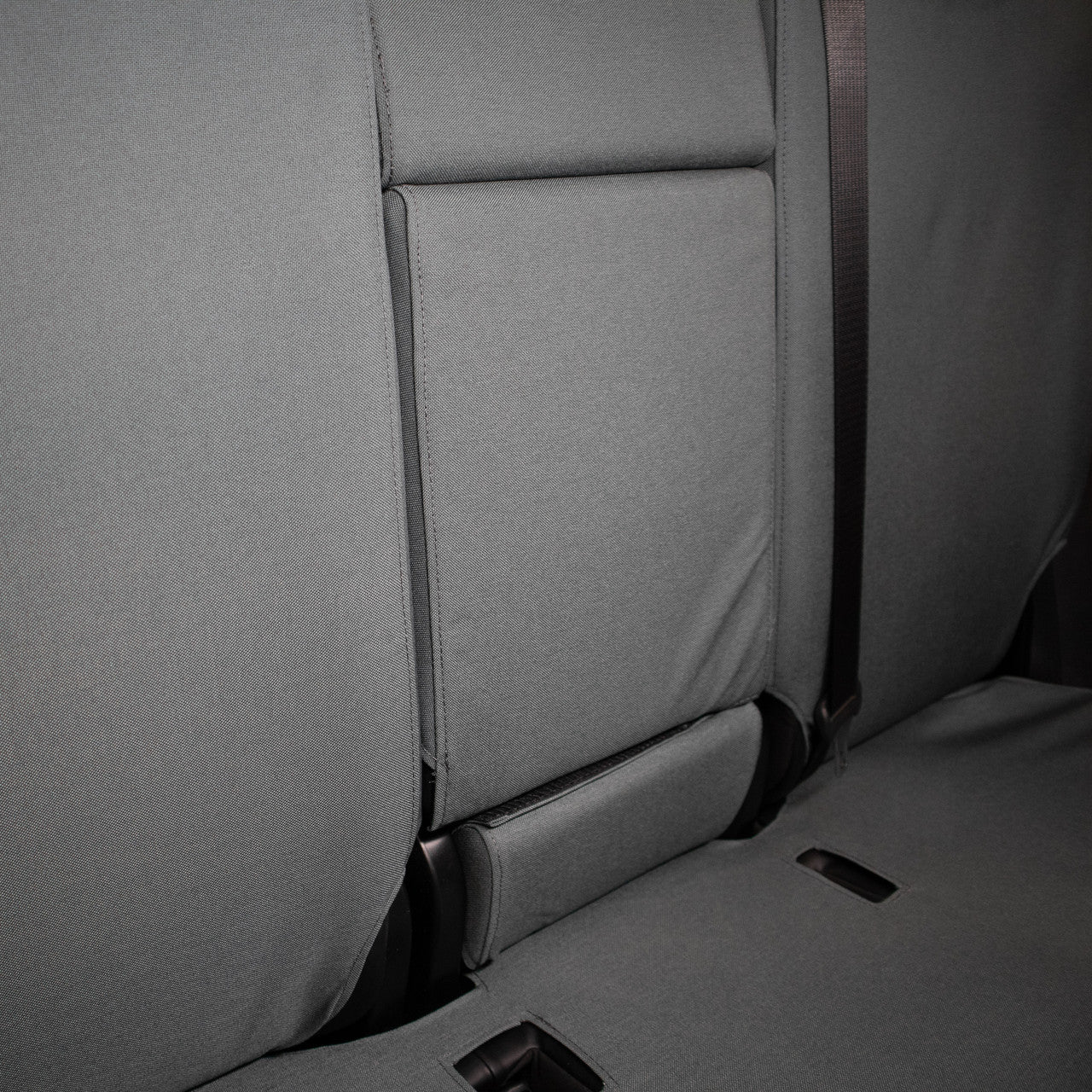TigerTough Tactical Seat Covers on the rear seat of a Tesla Model Y - Folding Armrest Detail