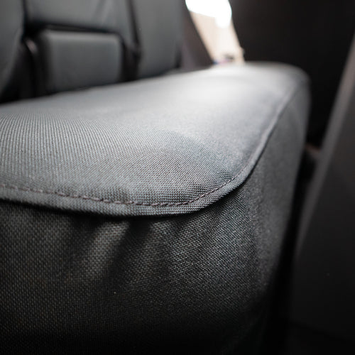 TigerTough Tactical Seat Covers on the rear seat of a Tesla Model Y