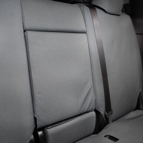TigerTough Tactical Seat Covers on the rear seat of a Tesla Model Y - Folding Armrest Detail