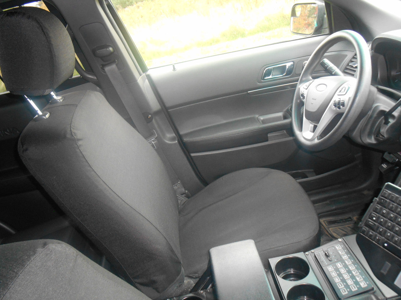 Ford Police Interceptor Utility with black TigerTough seat covers.