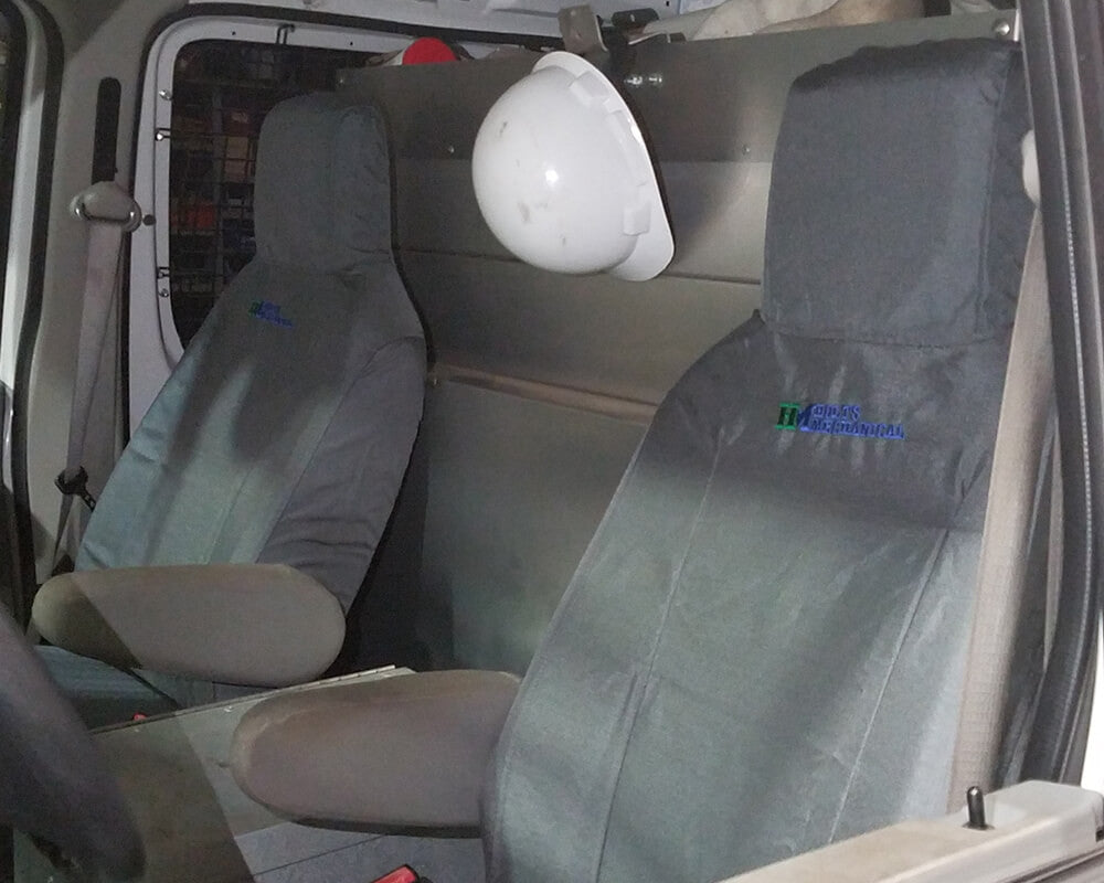 Ford bucket seats with gray TigerTough seat covers.